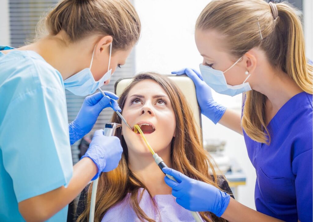 Dentist examining a patient's tooth to diagnose a cracked tooth and evaluate treatment options.